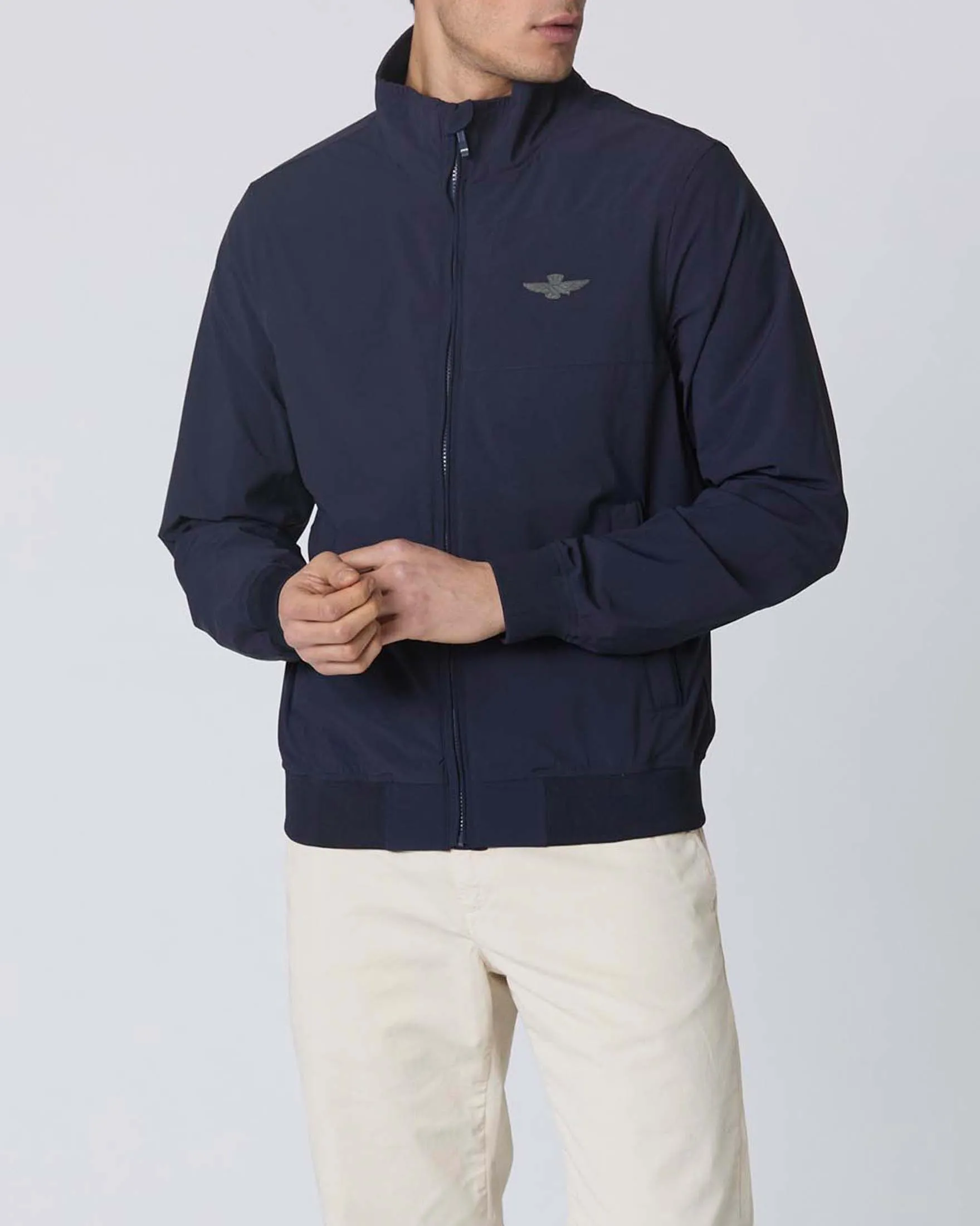 Giubbino bomber blu in tessuto stretch con ricamo aquila turrita